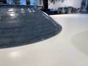 A Chinese monochrome blue Swatow dish with incised carp design, Ming